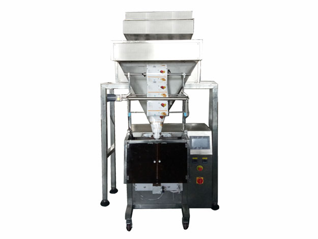 Multi head electronic weighing particle packing machine